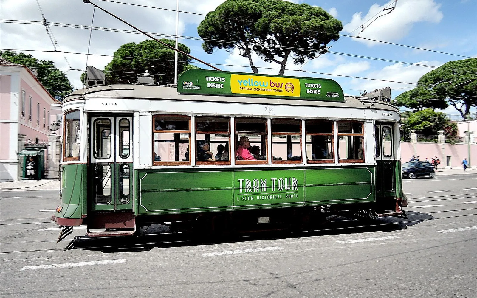 Yellow tram rolling through the streets of Lisbon, Portugal